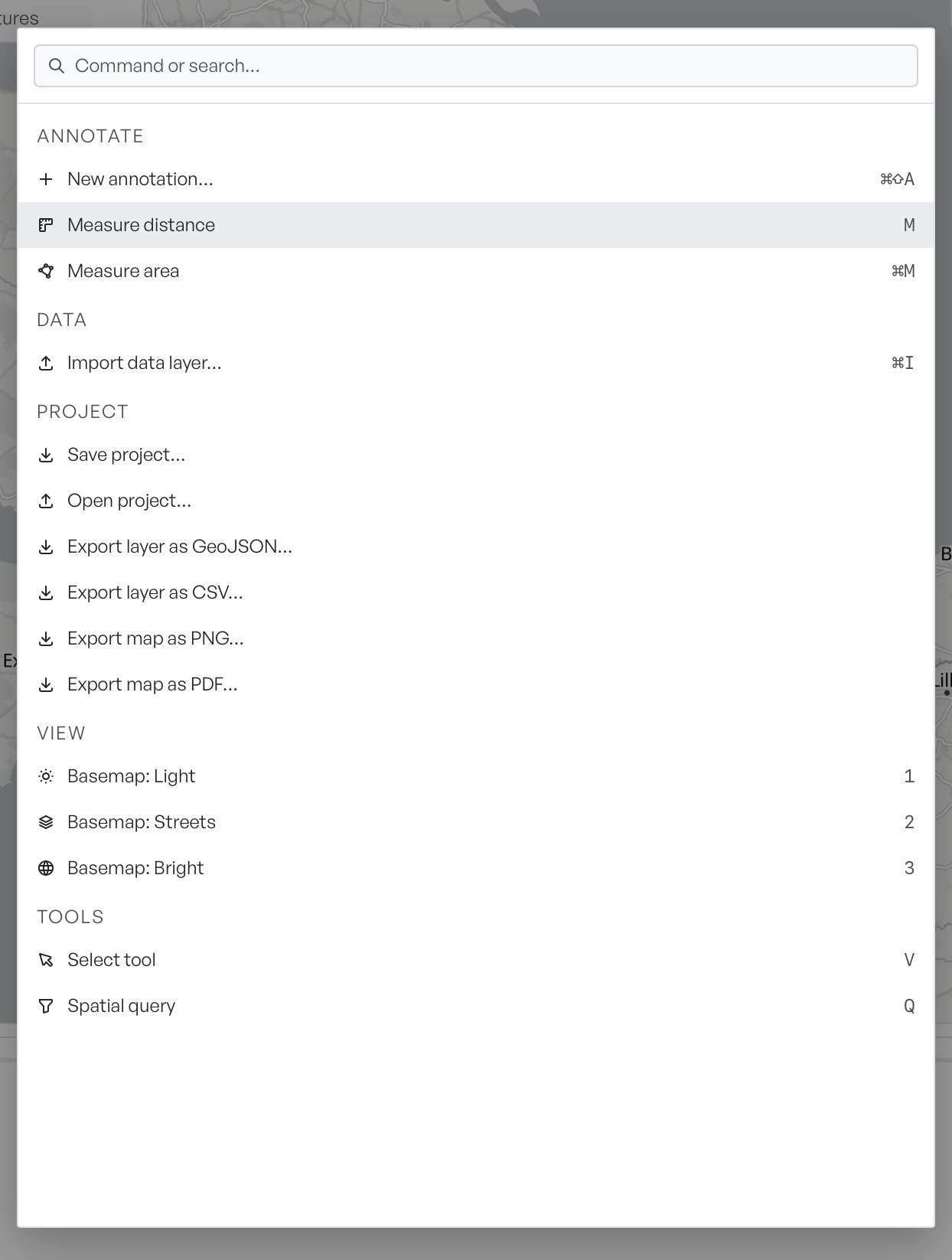 The command palette open over the map, listing the Annotate, Data, Project, View and Tools groups with their commands and keyboard hints