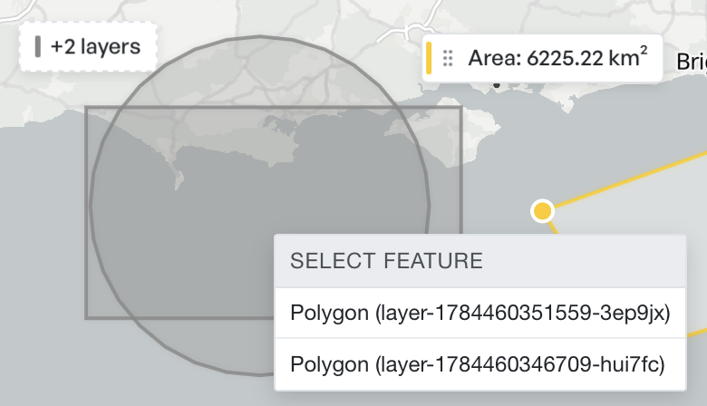 A feature picker on the map headed Select feature, listing two overlapping polygons to choose between